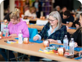 Women working on a Sweet Case team build.