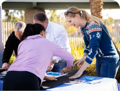Volunteers assembling skateboards at a team build