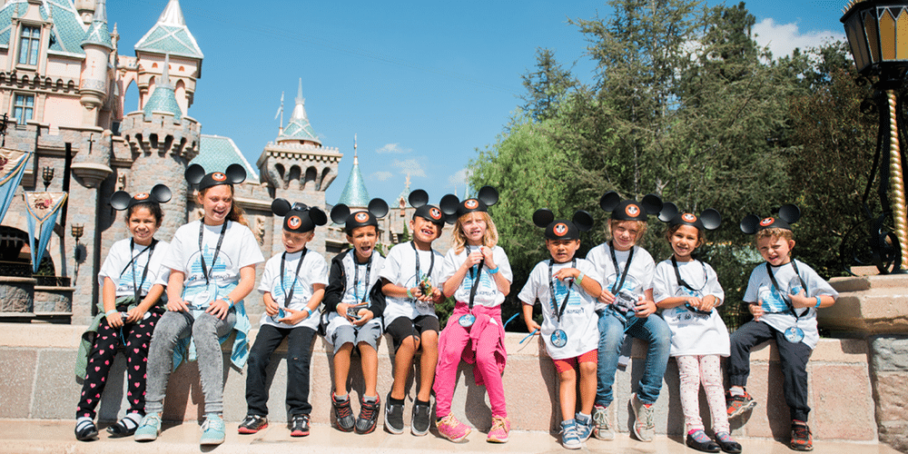 Group at Disney Days posing in front of the castle