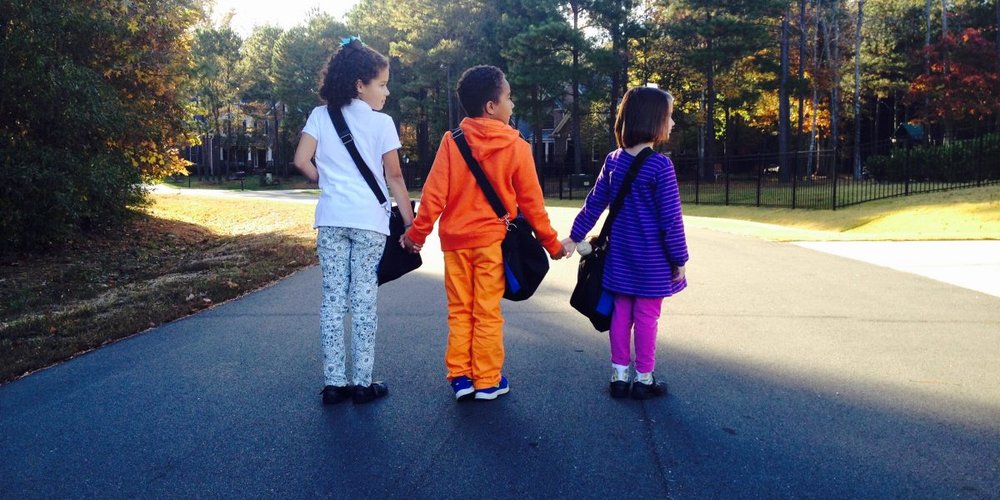 three little kids on the road San Antonio Non-Profits
