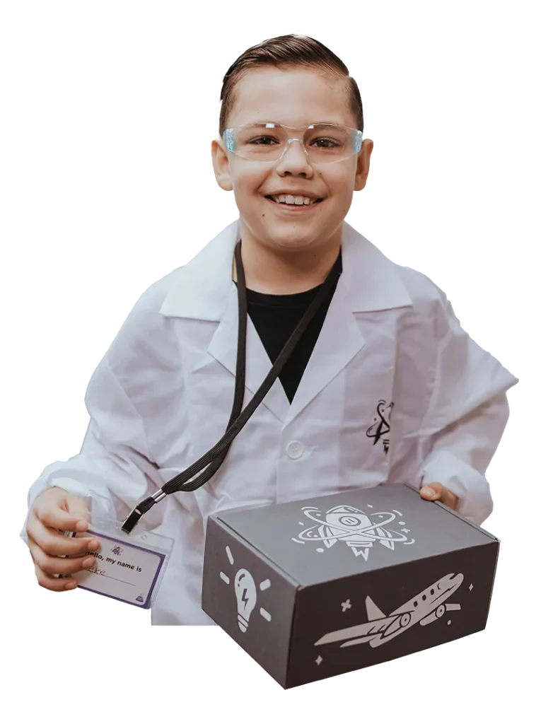 boy dressed as a scientist with his STEM box