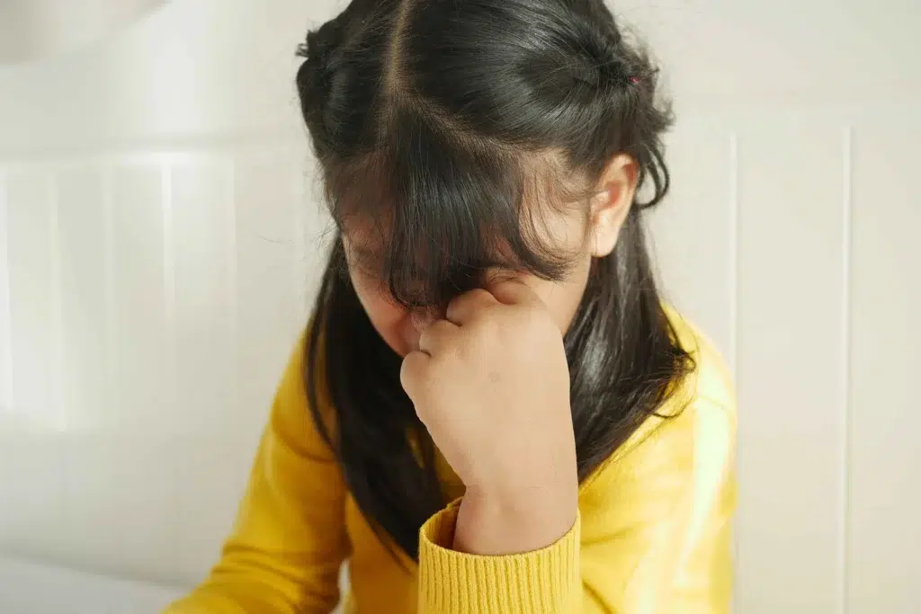 Girl in yellow crying