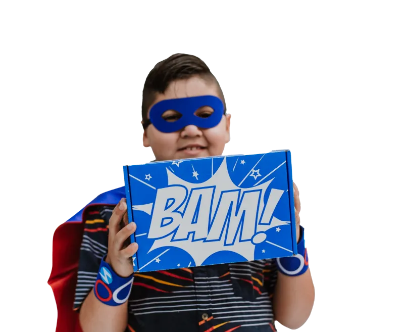 Boy holding up his superhero box