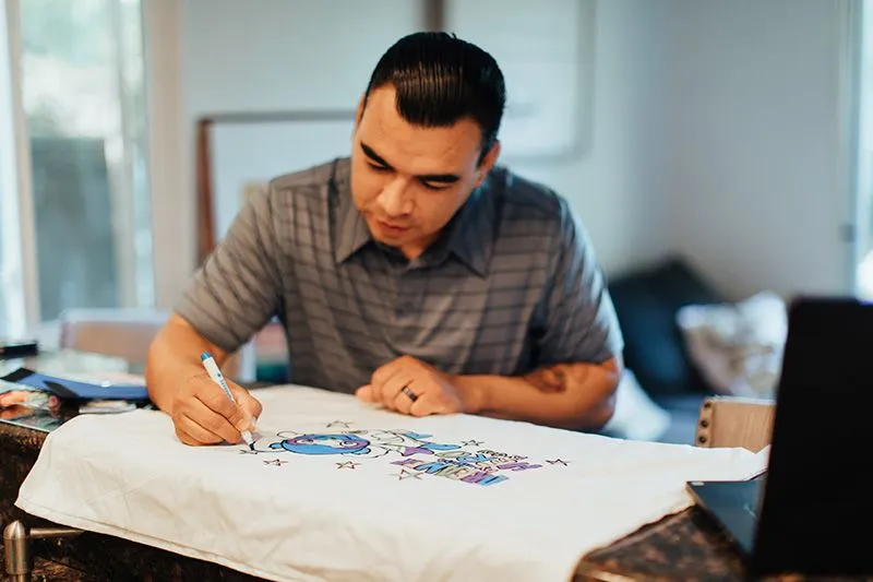 Man decorating his Superhero Kit virtual project