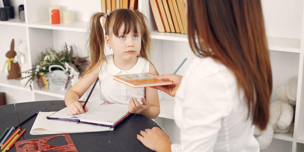 teacher and a child in learning facility