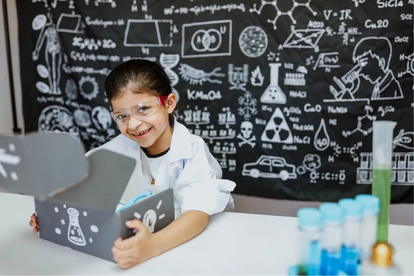Girl opening her STEM box in a laboratory