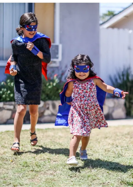 two girls dressed as superhero