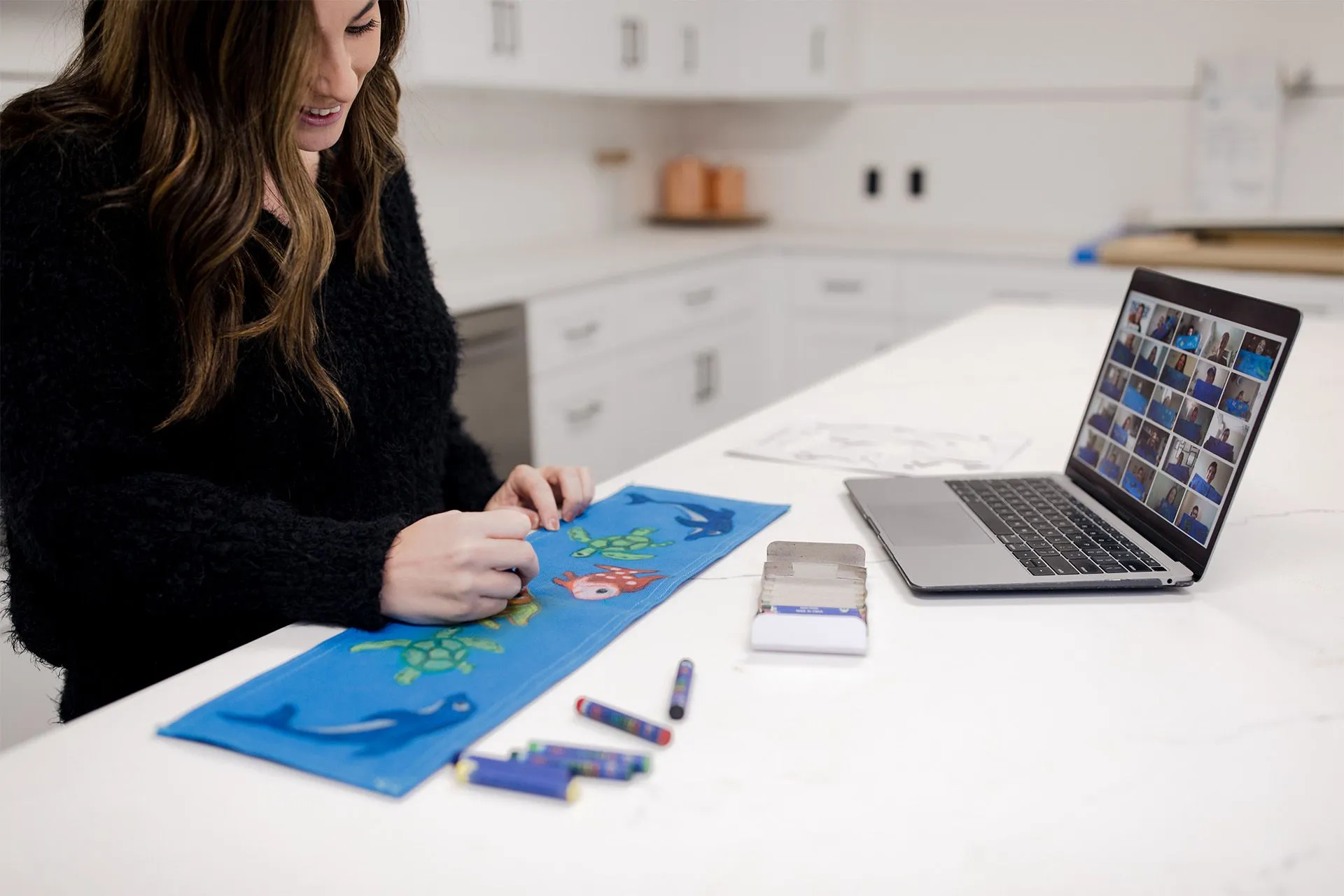 Woman decorating a Sweet Case virtual project kit panel