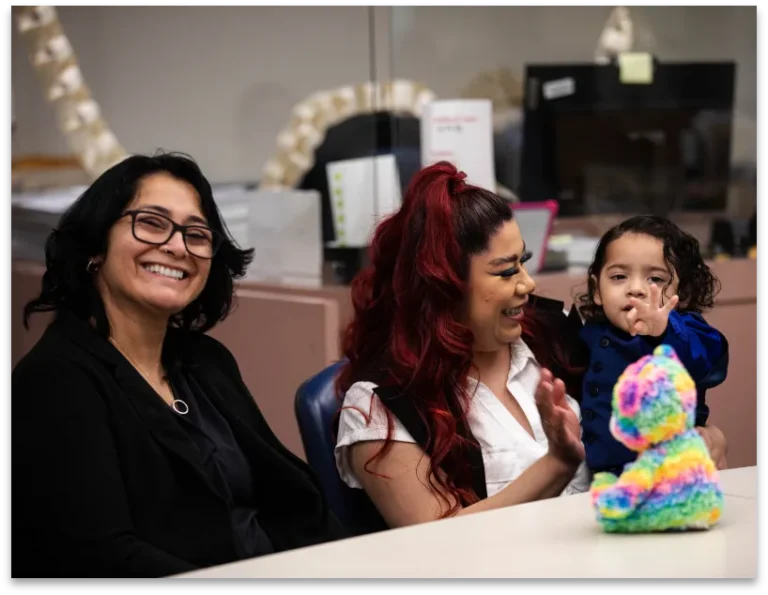 Parents at an adoption hearing in a courthouse