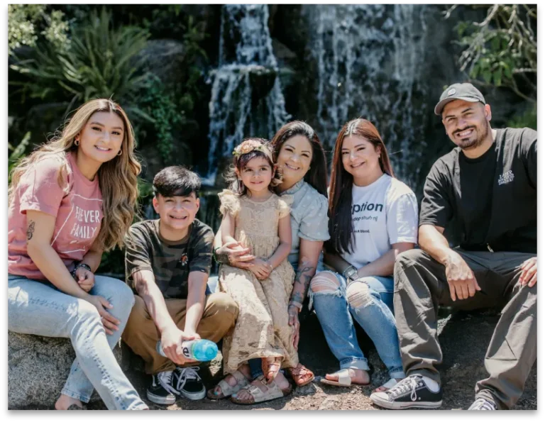 New family posing for their Framing Forever photo outdoors