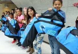 Kids holding their Sweet Cases
