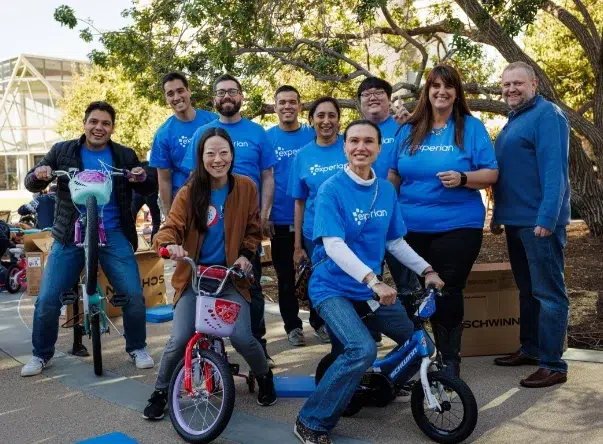 Gallery_1 Experian volunteers posing with bikes they built