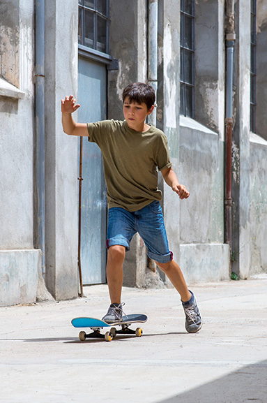 Boy balancing on a skateboard