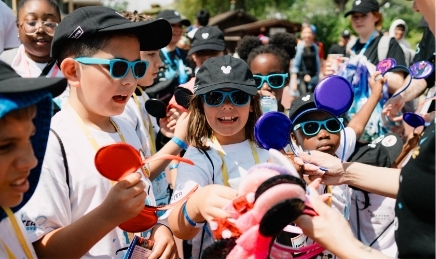 Kids receiving their Mickey ears at Disney Days