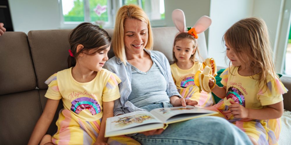 woman volunteering with foster kids by reading