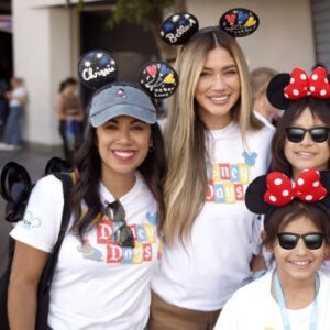 Chrissie Fit and Belle-a from Love Island USA stars at Disney Days, posing with kids in edited sunglasses