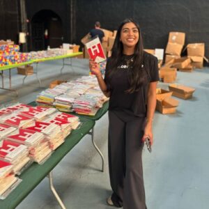worker showing off supplies at team building event with redwood credit union