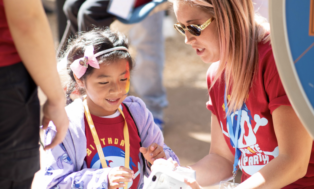 Child and volunteer at Birthday PAlooza