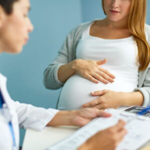 Pregnant woman sitting at the doctor's