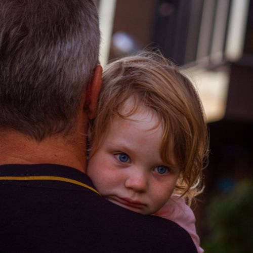 girl being carried by CPS worker