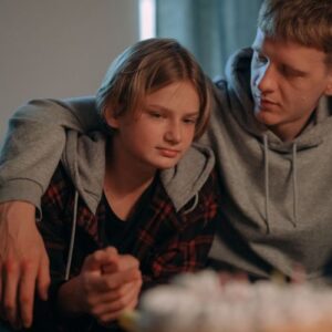 side hugging teen