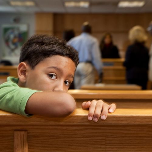 boy sitting in courtroom