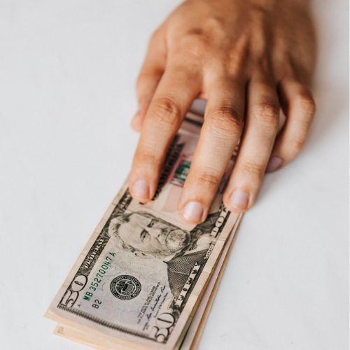 Hand passing over money